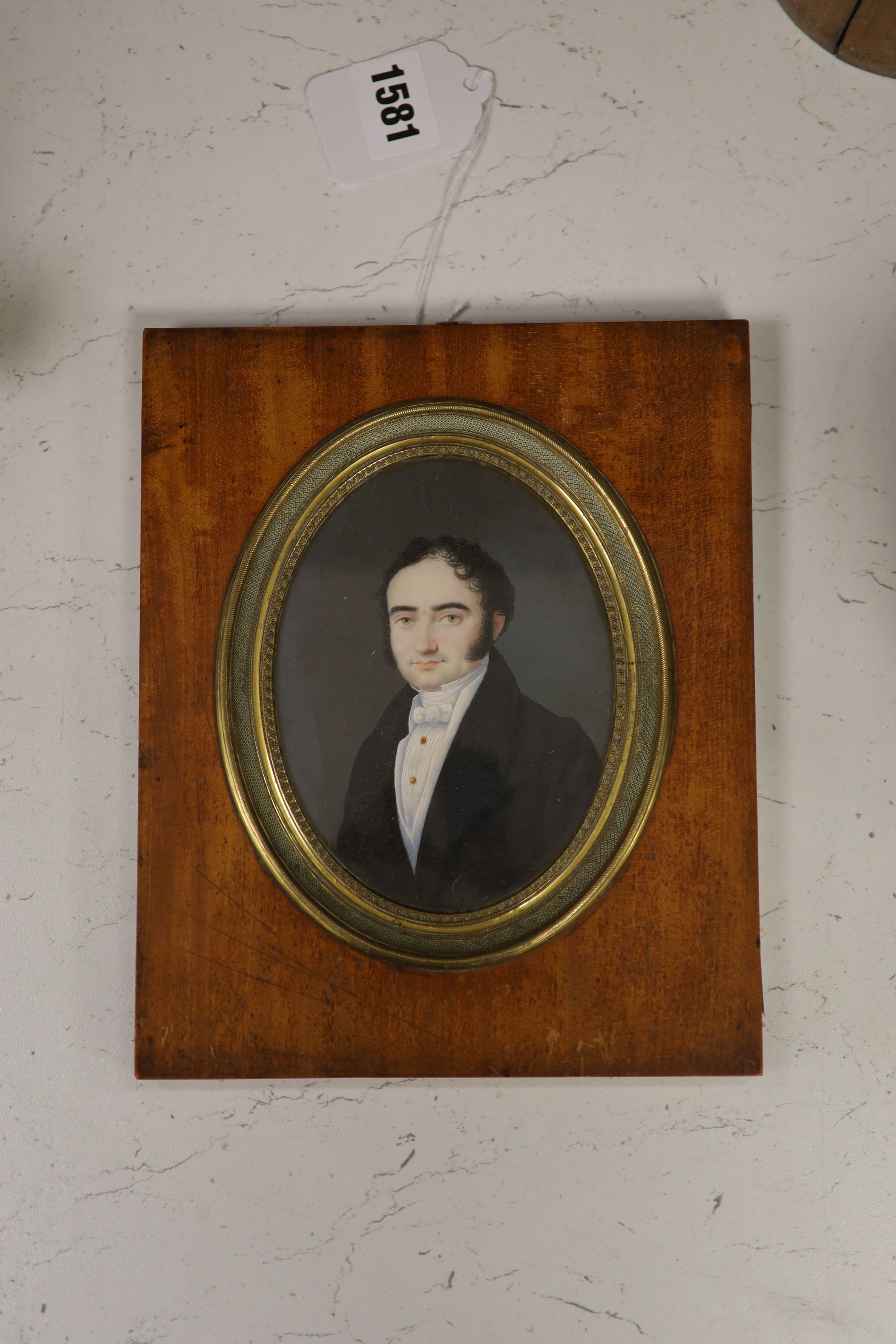 19th century French School, watercolour and gouache on ivory, Miniature portrait of a gentleman, 13 x 10cm (cracked)